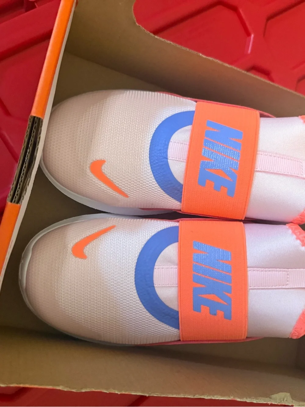 Nike Kids Slip-On Sneakers in white Orange & Purple Accents